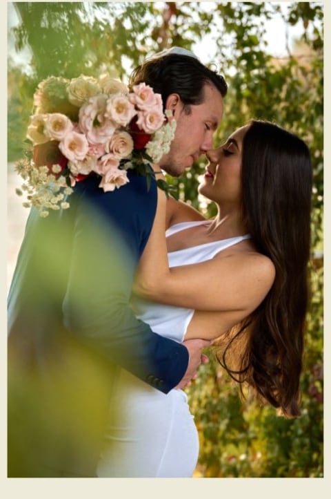 A bride and groom in the garden