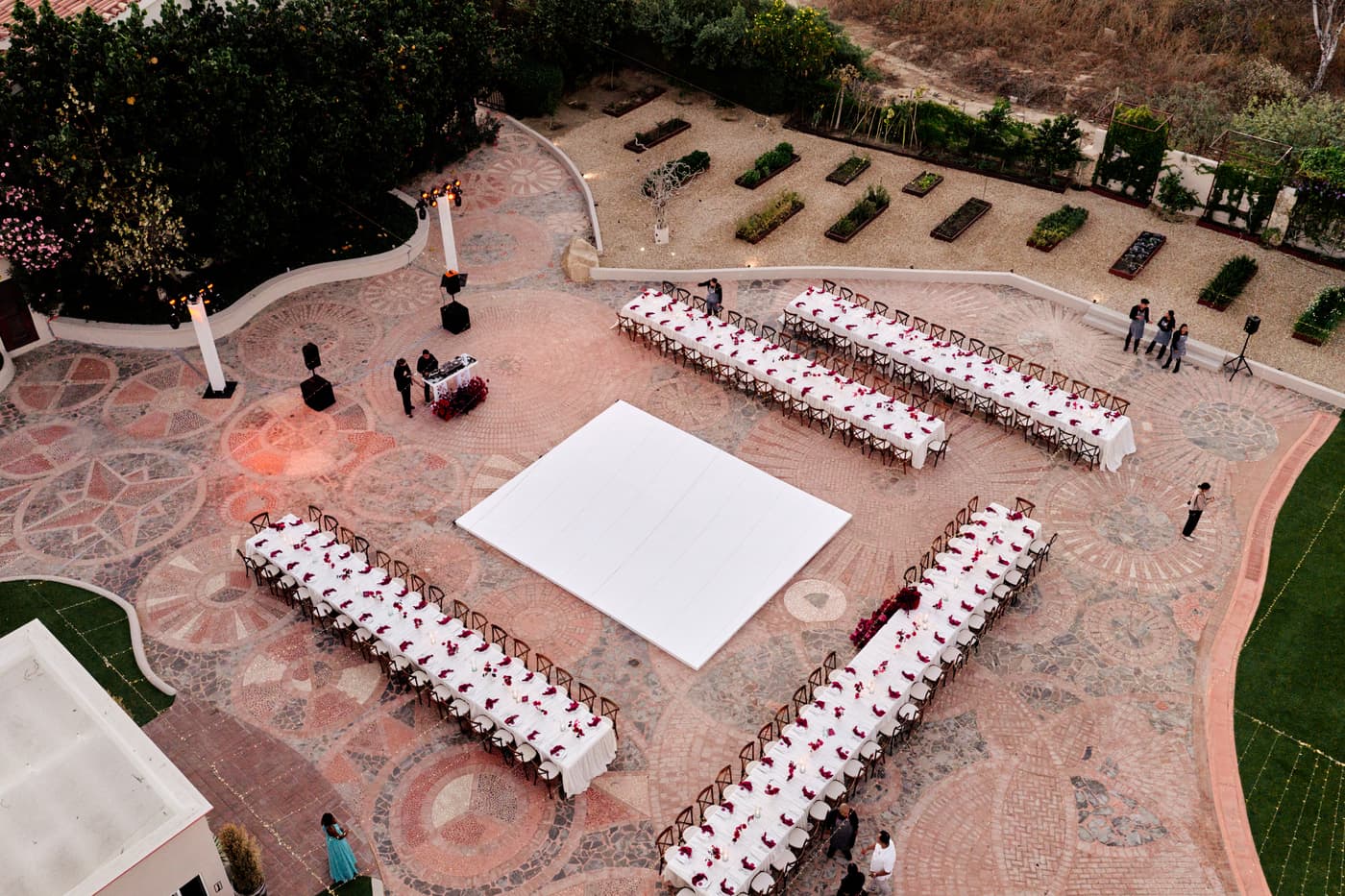 The reception set out across the mosaic terrace at golden hour